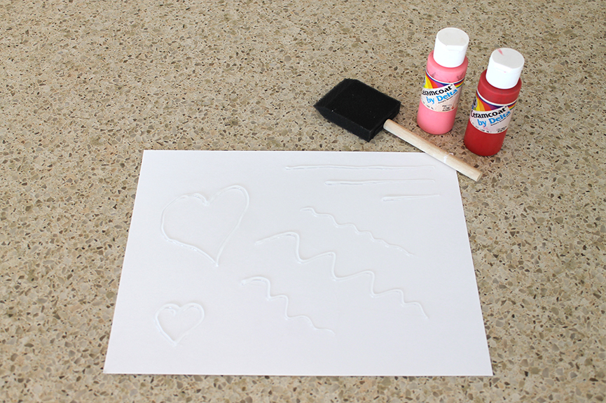 Make a Valentine resist art drawing using a hot glue gun and paint.