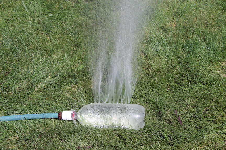 A pop bottle sprinkler is easy to make and give kids hours of fun playing in the water.
