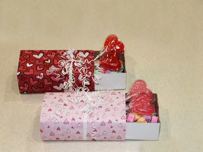 Make this Valentine candy box out of an empty match box.